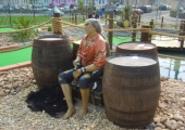 PIRATE SITTING ON TREASURE CHEST IN TORBAY