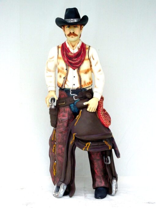 COWBOY WITH SADDLE JR 372